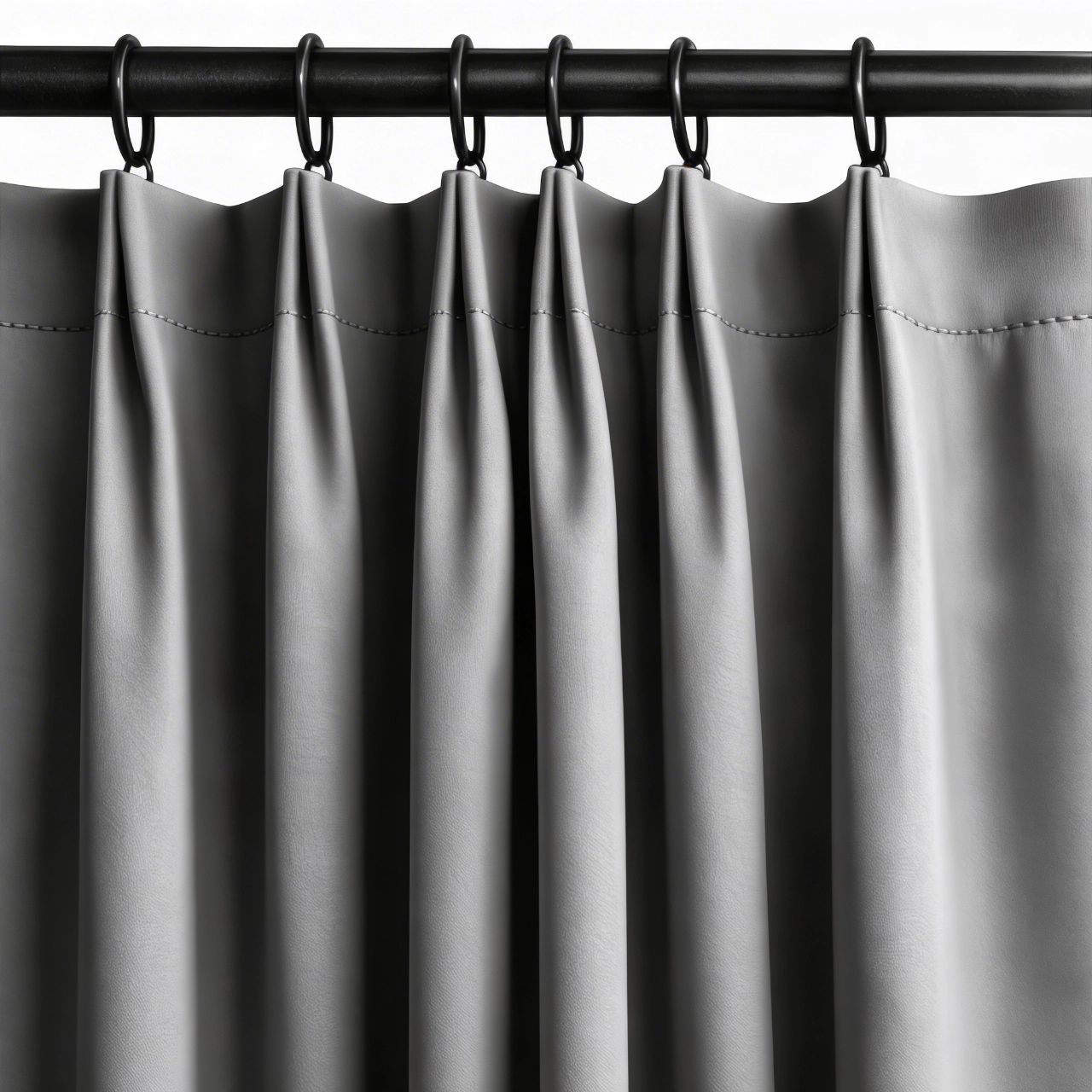 Cortina con Tailor pleat o pastelón tipo sastre instalada sobre un cortinero tubular con argollas